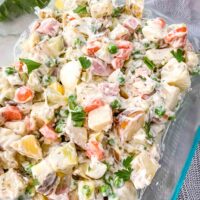 Closer view of Olivier Salad in a glass dish