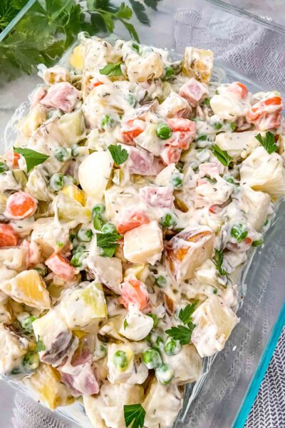 Closer view of Olivier Salad in a glass dish