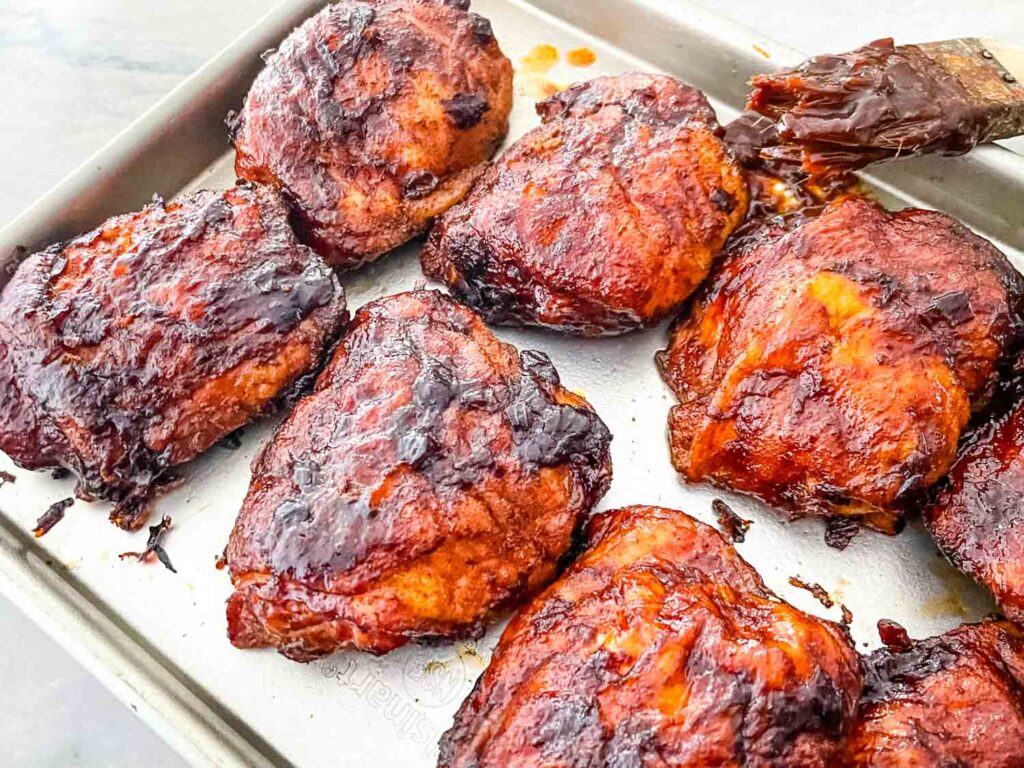 Smoked Chicken Thighs on a baking sheet