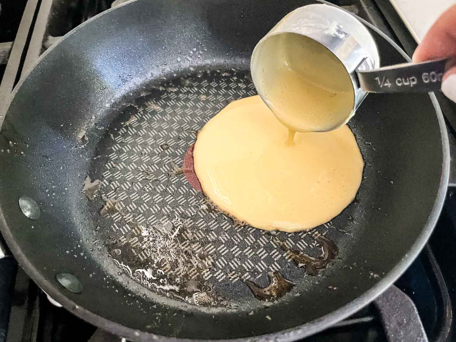 Pour the batter into a buttered skillet
