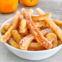 Candied Orange Peel piled up in a small bowl on a counter