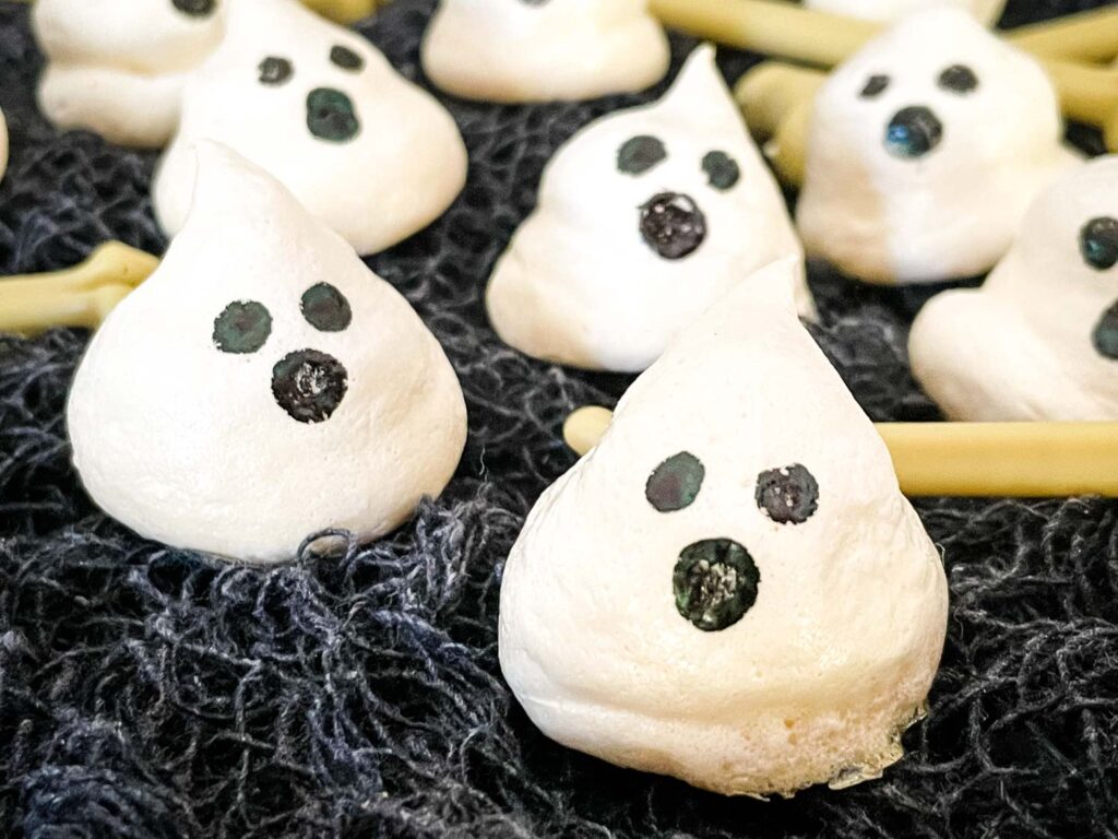 Halloween Ghost Meringues on dark cloth