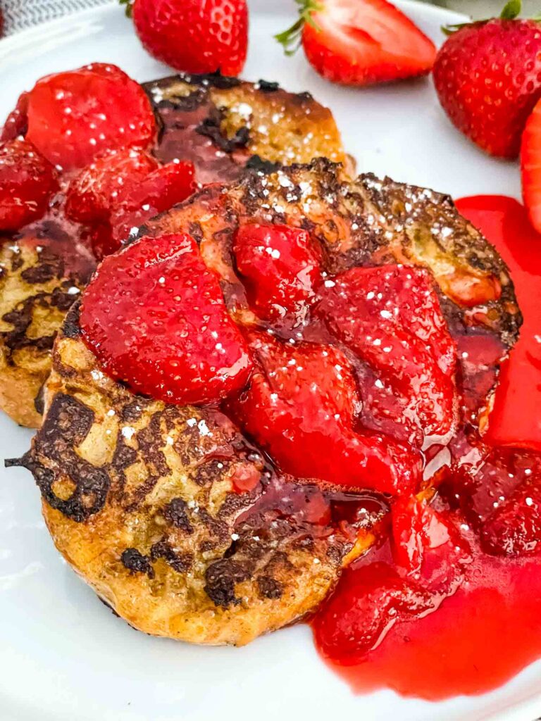 Close view of Strawberry French Toast on a white plate