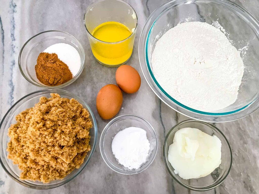 All of the ingredients needed for the cookies in bowls
