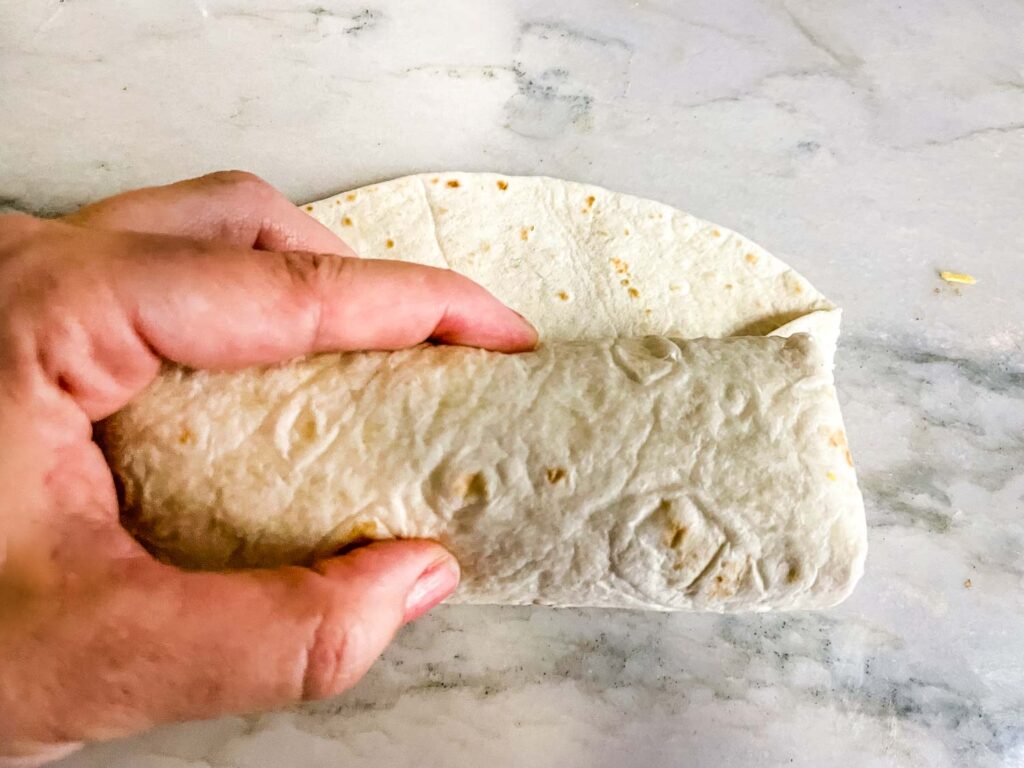 Rolling the burrito the rest of the way
