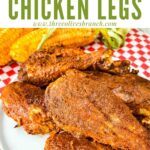 Pin of Smoked Chicken Legs in a pile on a red checkered placemat with title at top