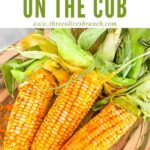 Pin of Smoked Corn on the Cob in a glass dish with title at top