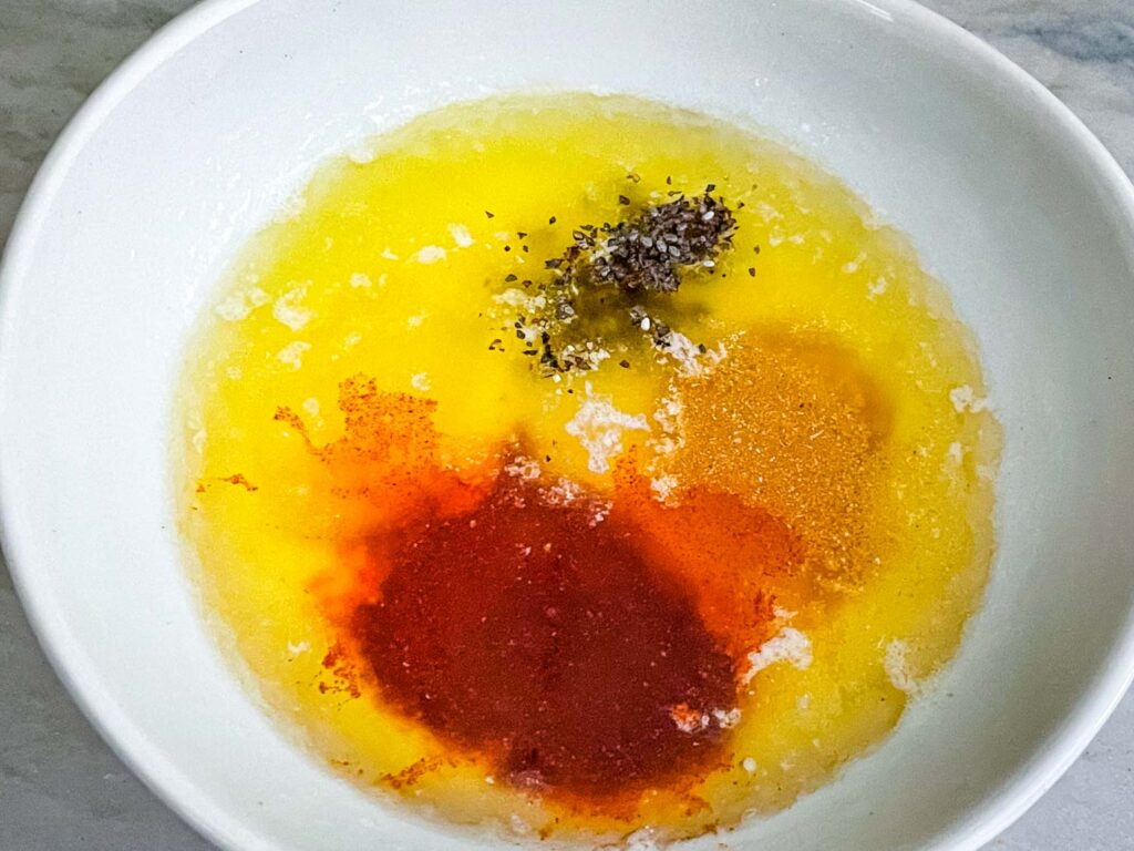 The ingredients for the butter sauce in a bowl together