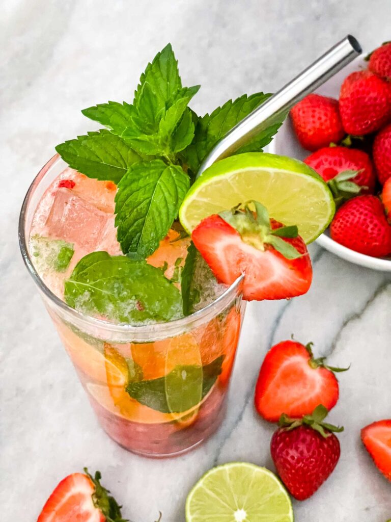 Top view of a garnished Strawberry Mojito in a glass