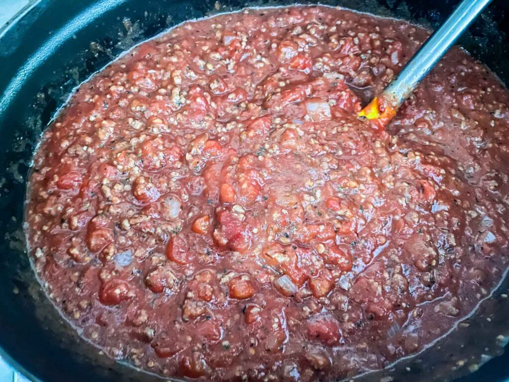 The sauce simmering in a pot