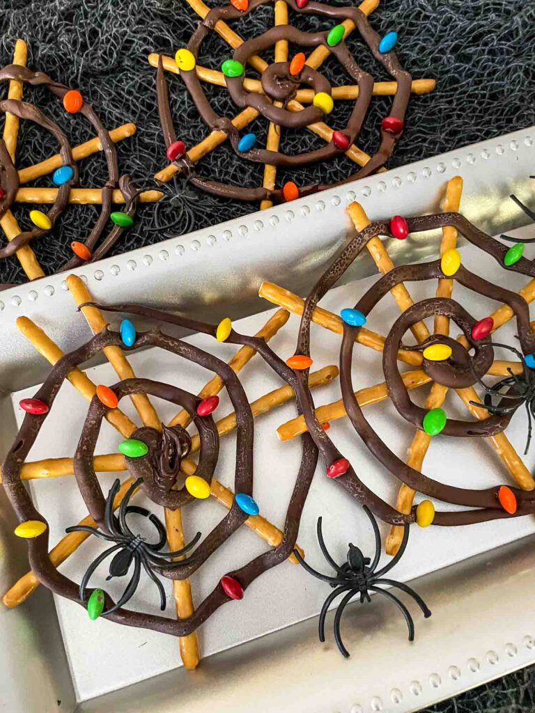 Nightmare Before Christmas Spiderwebs on a silver tray with plastic spiders
