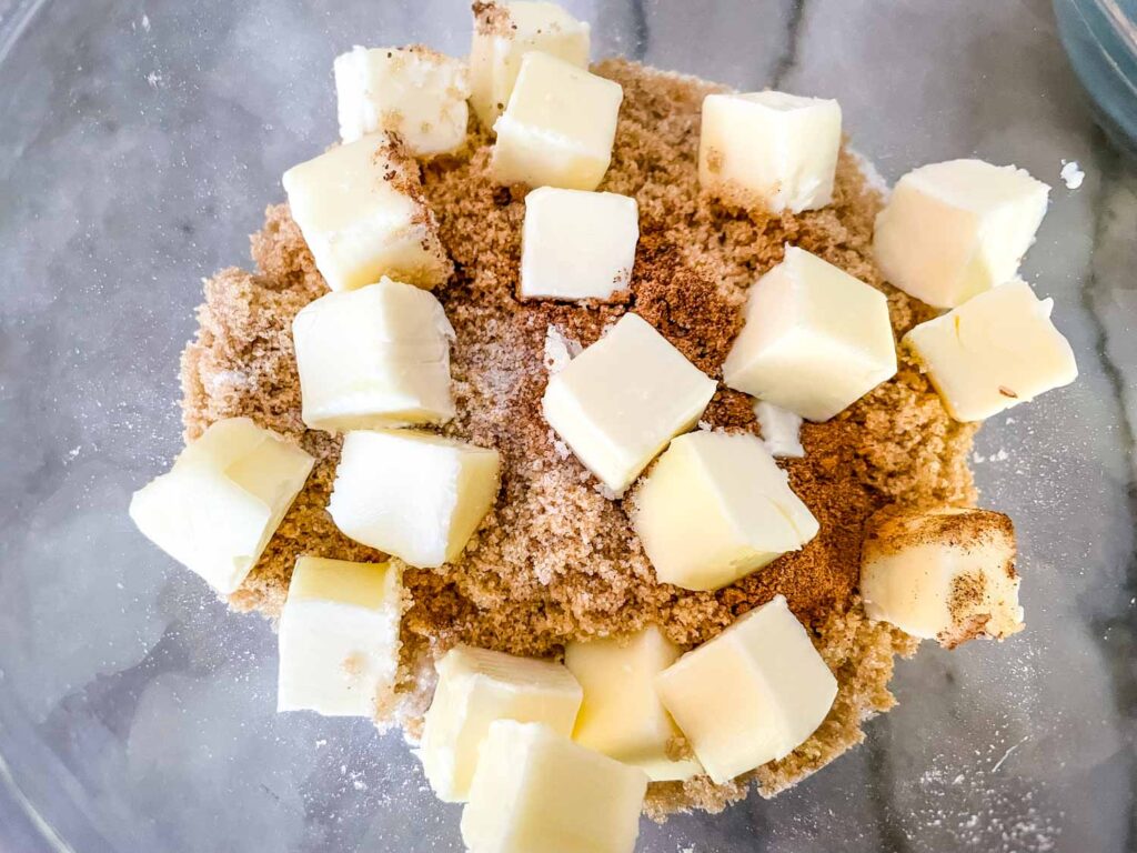 Making the cristp topping with butter chunks on top of the dry ingredients