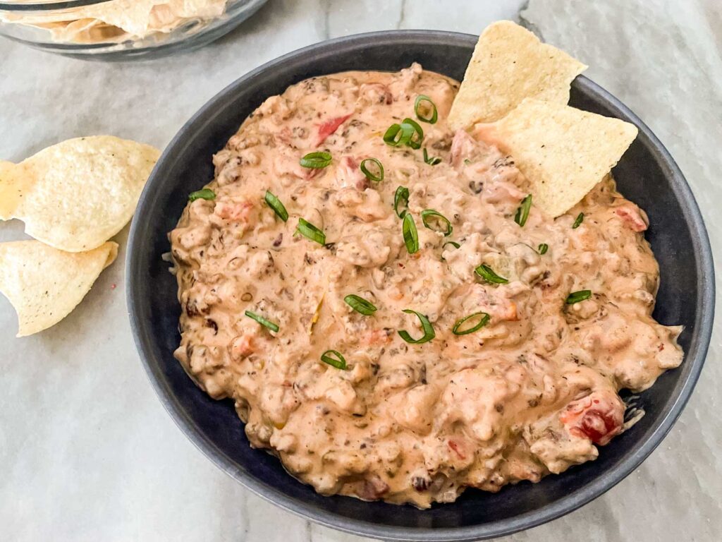 Sausage Dip in a gray bowl with chips in it