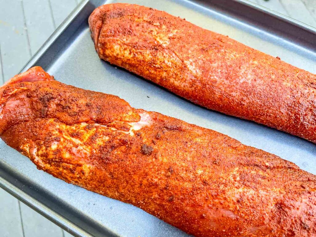 The Smoked Pork Tenderloins on a baking sheet