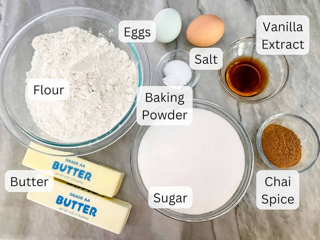 Ingredients needed for Chai Sugar Cookies all labeled on a counter