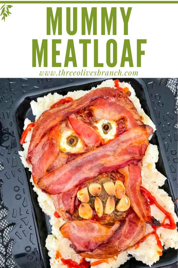 Pin of Halloween Mummy Meatloaf on a black platter with title at top