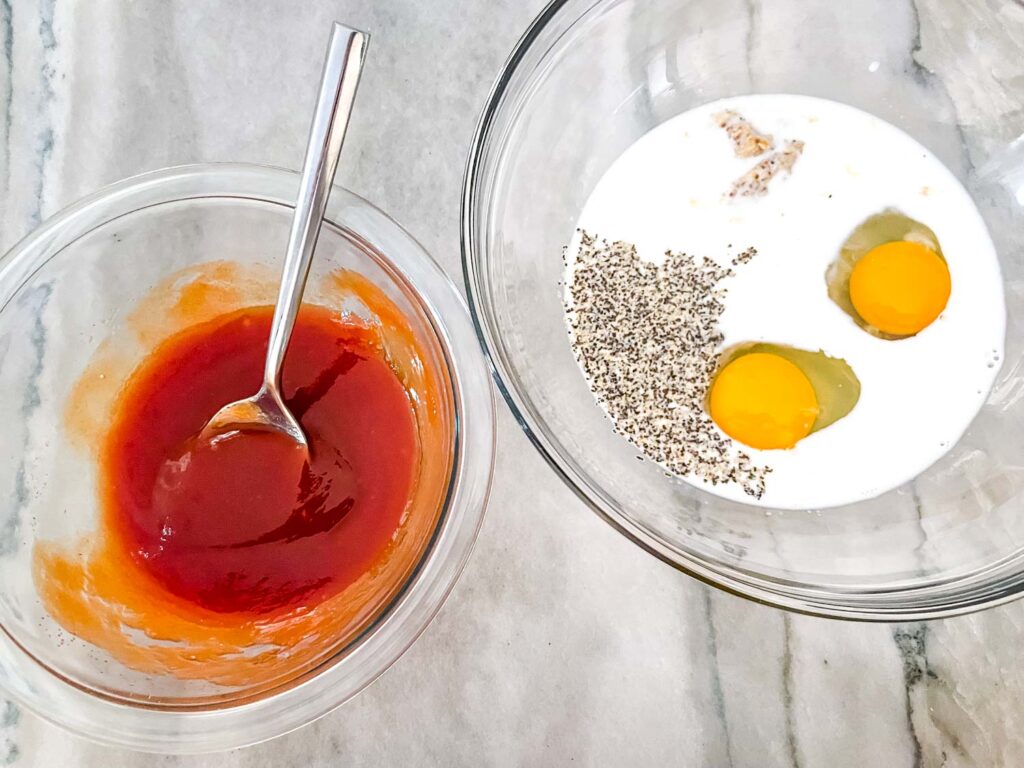 A bowl of the ketchup mixture and a bowl with the milk mixture