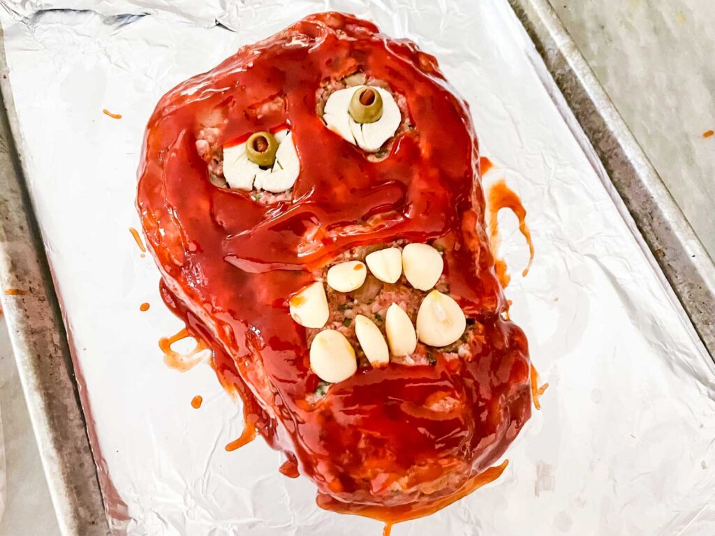 The mummy head covered in the ketchup sauce