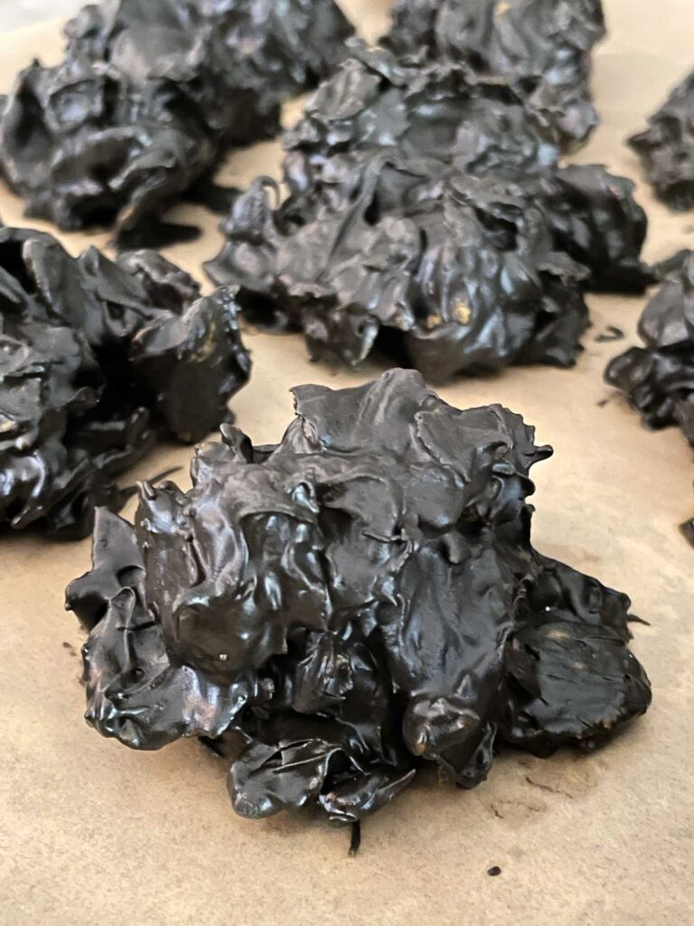 No Bake Lump of Coal Cookies drying on parchment