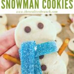 Pin of a hand holding a Shortbread Snowman Cookie with title at top