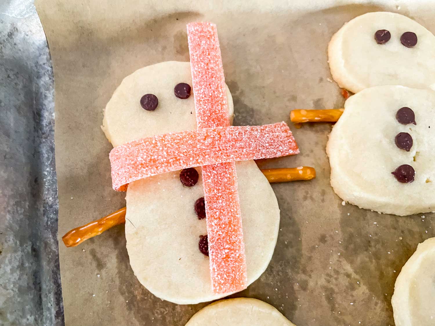 The front of a cookie with the scarf being assembled