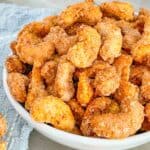 Close view of Sweet and Spicy Candied Cashews piled up in a bowl