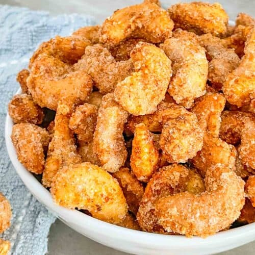 Close view of Sweet and Spicy Candied Cashews piled up in a bowl