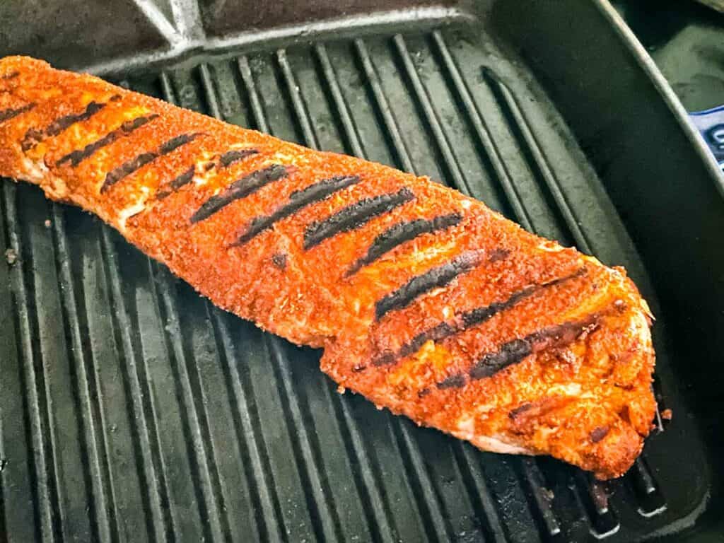 The tenderloin being grilled