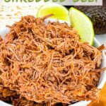 Pin of Instant Pot Shredded Beef Barbacoa in a small bowl with title