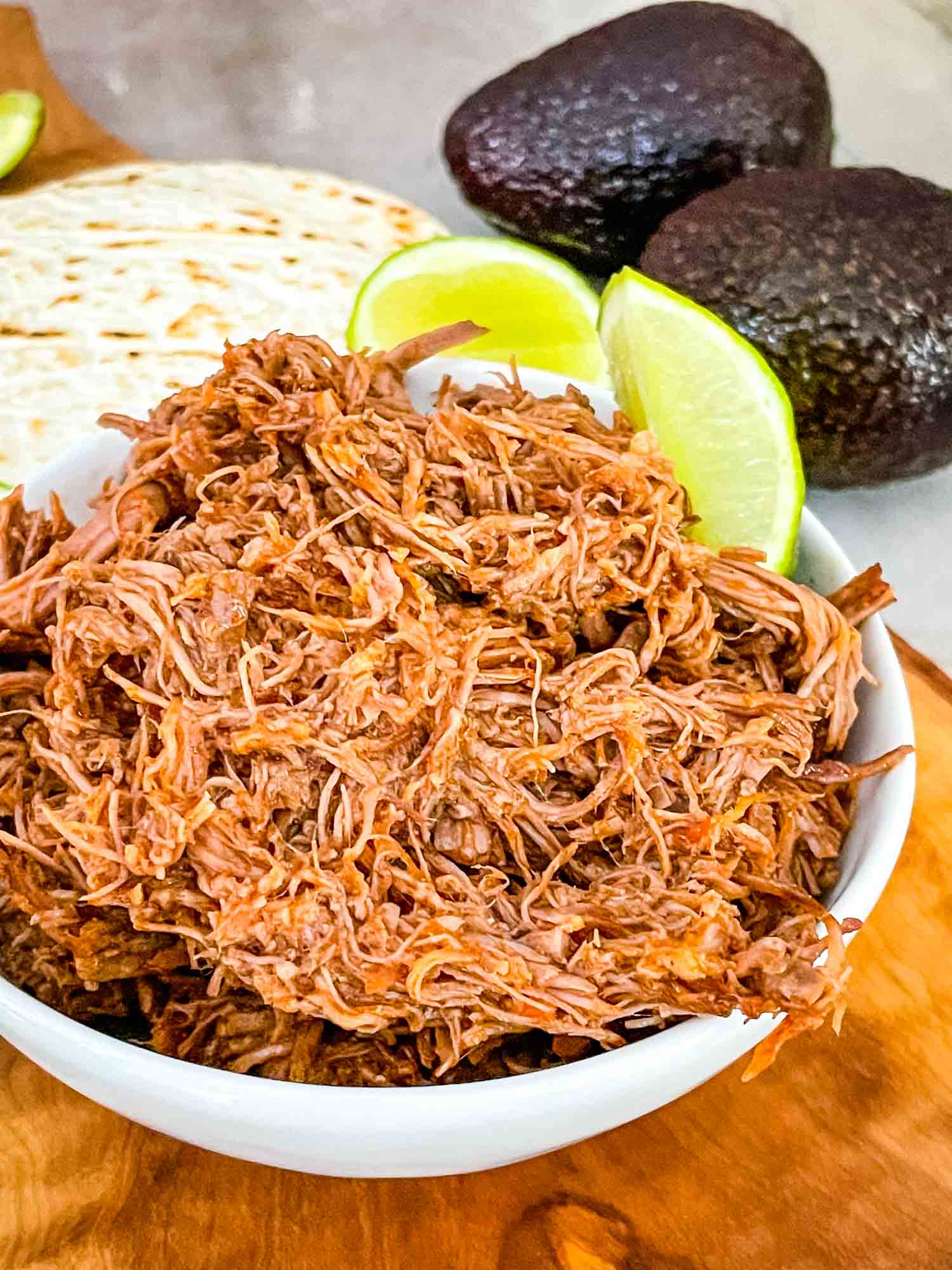 Instant Pot Shredded Beef Barbacoa in a small white bowl