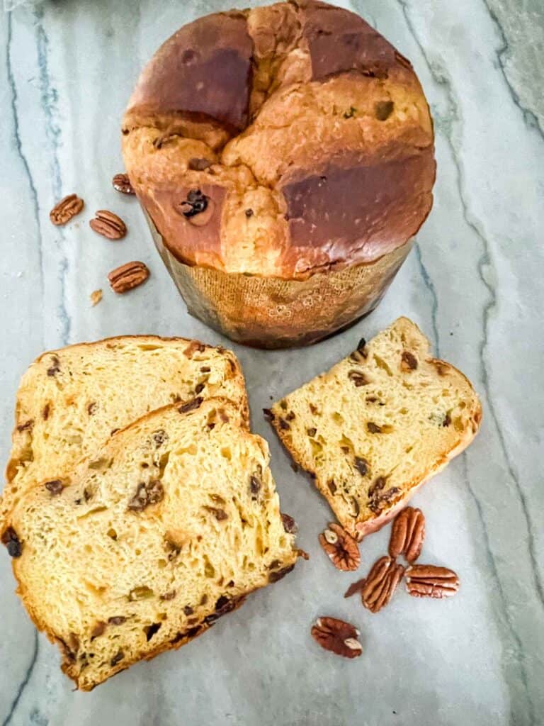 A whole and sliced panettone