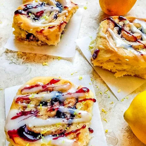 Blueberry Lemon Sweet Rolls layed out on a counter