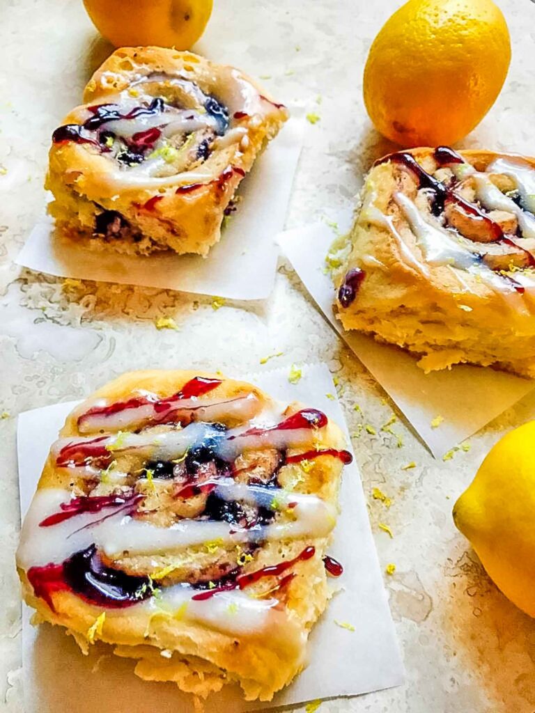 Blueberry Lemon Sweet Rolls layed out on a counter