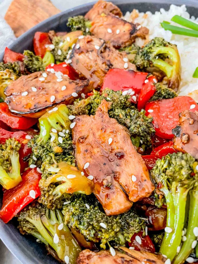 Close view of Teriyaki Chicken Stir Fry in a gray bowl