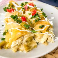 End view of two Creamy Chicken Enchiladas on a plate