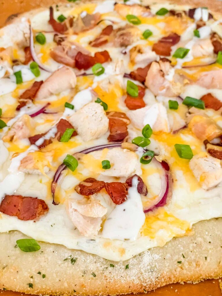 Close view of the toppings on a Chicken Bacon Ranch Pizza