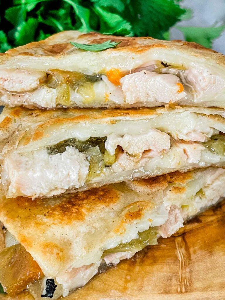 Close view of the quesadilla filling with pieces stacked on top of each other