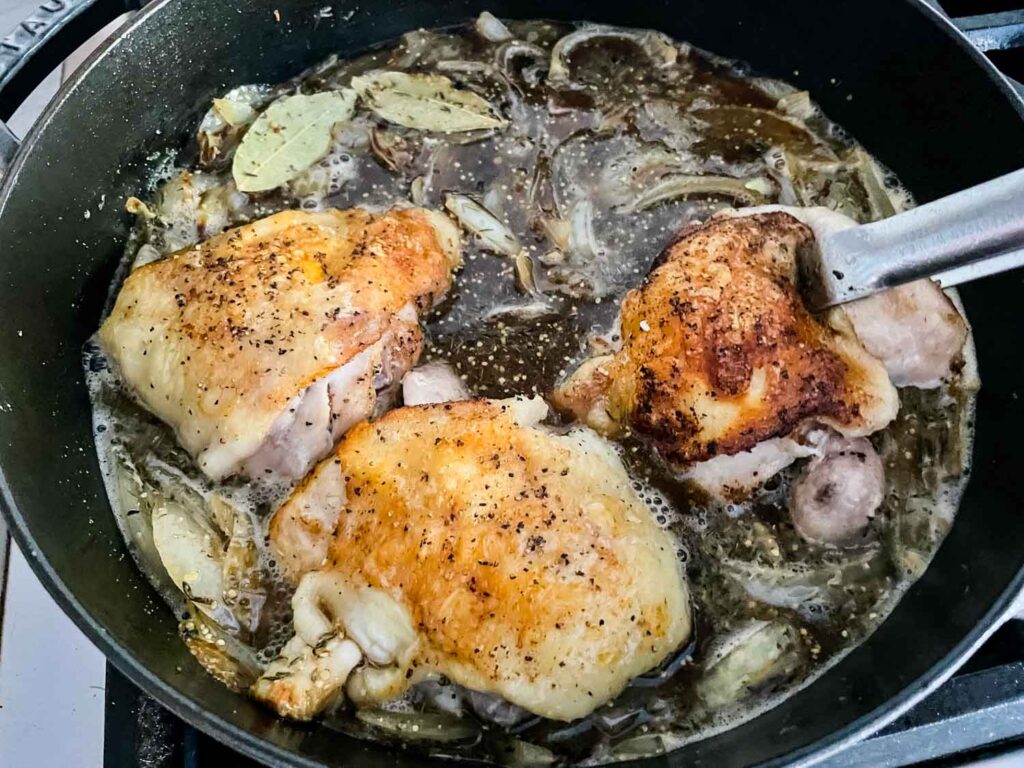 Adding the chicken back into the sauce