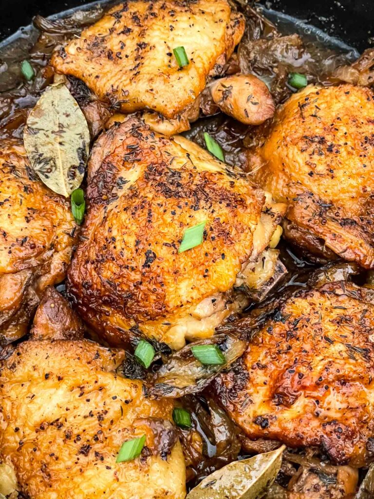 Closer view of Beer Braised Chicken Thighs after cooking in the braiser