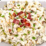 Pin of Colcannon with Bacon in a serving dish with title