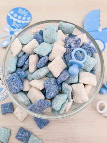 Top view of blue and white It's a Boy Puppy Chow in a bowl on a table