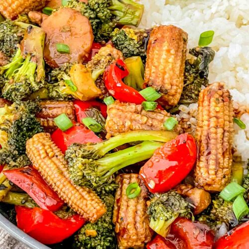 Close view of Vegetable Teriyaki Stir Fry in a bowl with white rice