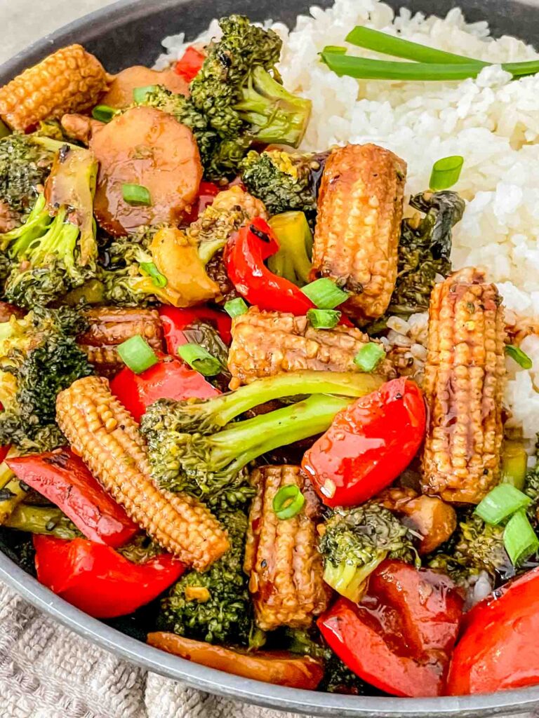 Close view of Vegetable Teriyaki Stir Fry in a bowl with white rice