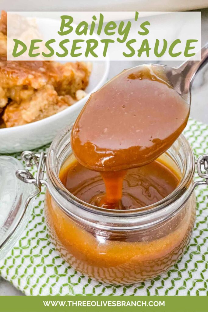 Pin for Irish Cream Dessert Sauce with a spoon dipping into a pot of the sauce and title at top