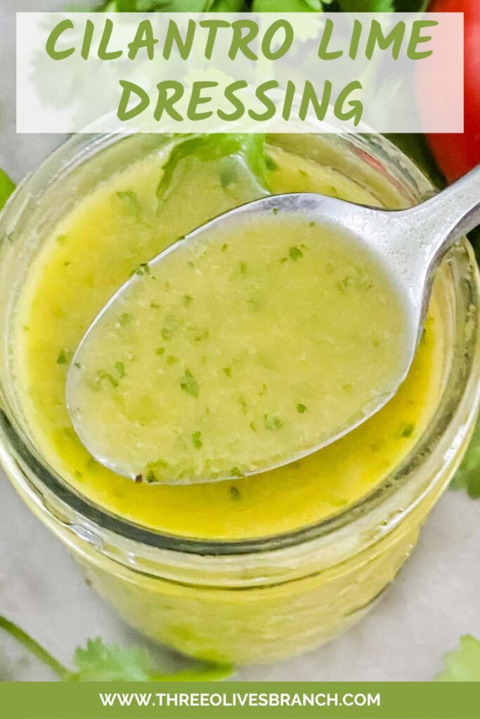 Pin of Cilantro Lime Vinaigrette Salad Dressing in a jar with a spoon coming out of it and title at top