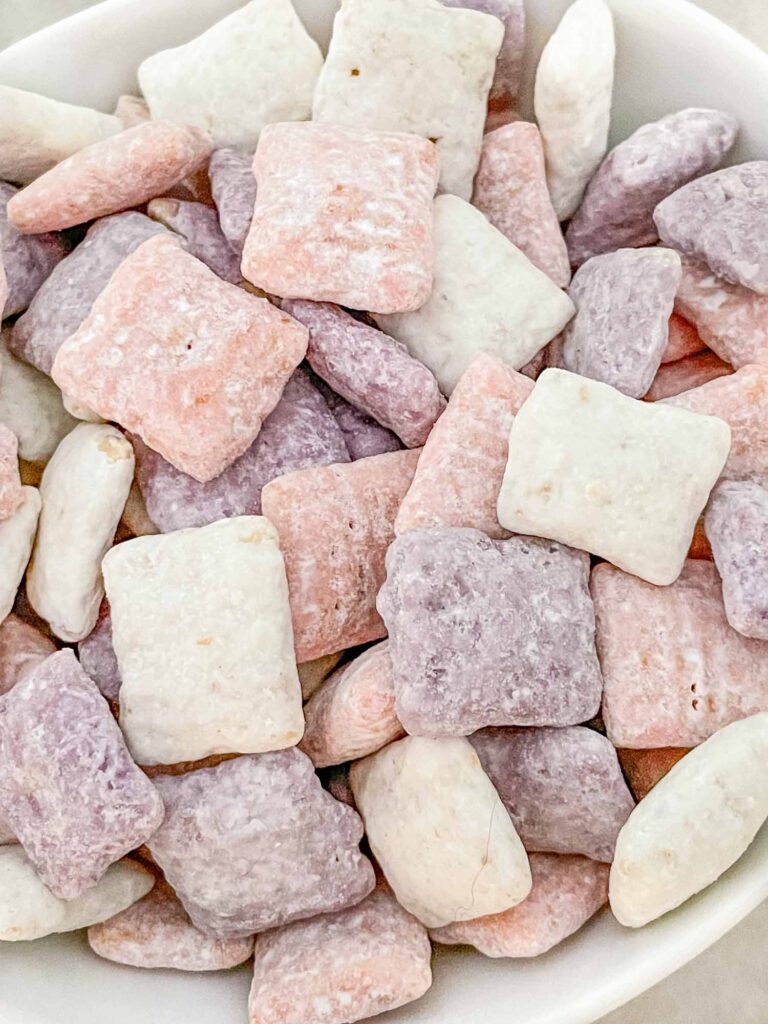 Close view of It's a Girl! Puppy Chow in purple, pink, and white