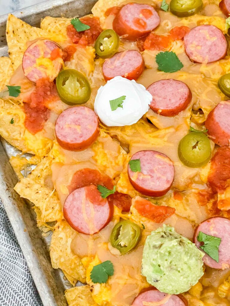 Sausage Beer Cheese Nachos after baking on a cookie sheet