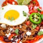 Shredded Beef Red Chilaquiles in a bowl