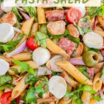 Pin of Italian Antipasto Pasta Salad in a clear bowl with title at top