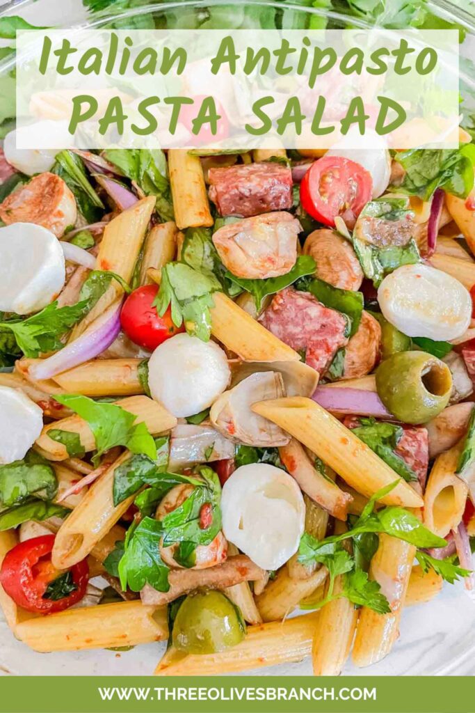 Pin of Italian Antipasto Pasta Salad in a clear bowl with title at top